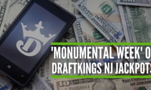 phone with draftkings logo on pile of money