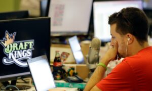 draftkings employee works at computer