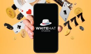 white hat studios logo on phone with casino slots behind
