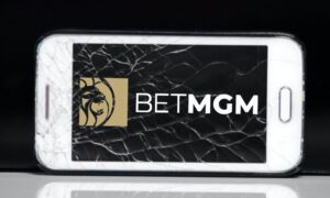 betmgm logo on phone with broken screen