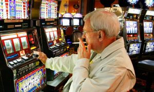 A customer smokes in an Atlantic City casino. The New Jersey Senate is considering a bill to institute a smoking ban among AC casinos.