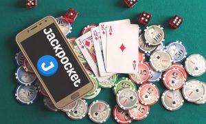 image of a casino table with Jackpocket on a phone, as the lottery courier targets a launch for an online casino in New Jersey