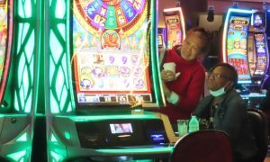 Gamblers play slots at Harrah's Atlantic City for a story on the January 2024 revenue report by Atlantic City casinos