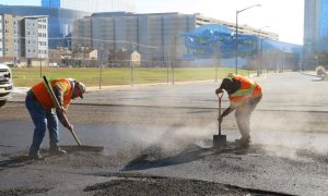 Workers repave Atlantic Avenue for the 'road diet' project that Atlantic City casinos look to stop at a March 18 hearing