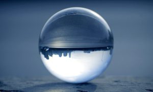 Image of an upside-down city skyline through a crystal ball for a story on the trend of legal gambling in New Jersey