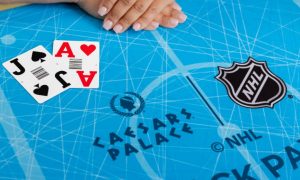 Image of Caesars Palace Online Casino blackjack table with the NHL logo for a story on NHL-branded games arriving in New Jersey