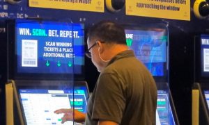 Image of a bettor wagering at FanDuel Sportsbook for a story on New Jersey changing revenue reports to break them down by individual skins