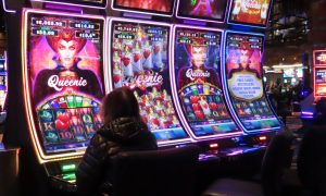 Patron plays slots at Ocean Casino Resort for a story on profits for Atlantic City casinos continuing to decline in 2023