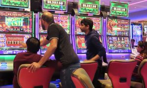 Image of gamblers play slots at Hard Rock Atlantic City for a story on the April 2024 revenue report for Atlantic City casinos.