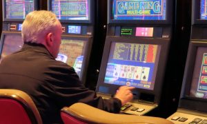 Image of a gambler playing at Hard Rock Atlantic City for a story on first quarter profits for Atlantic City casinos in 2024.
