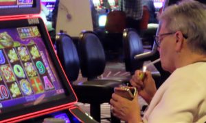 Woman smokes while gambling in Atlantic City for a story on the first hearing of a lawsuit challenging the legality of allowing smoking in Atlantic City casinos.