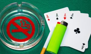 Image of a cigarette on a casino poker table for a story on Atlantic City casino employees remaining hopeful for a positive ruling on a smoking ban lawsuit.