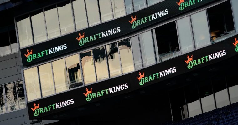 DraftKings signage at Gillette Stadiums for a story on the New Jersey sportsbook getting fined $100,000 for filing incorrect revenue reports.