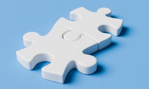 Two puzzle pieces fit together for a story on how Flutter can acquire and improve ESPN Bet in the New Jersey sports betting and online casino markets.