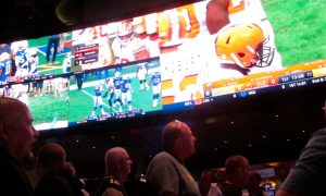 Customers watch football inside the Ocean Casino Resort sportsbook in Atlantic City.