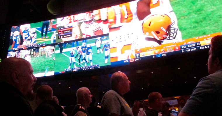 Customers watch football inside the Ocean Casino Resort sportsbook in Atlantic City.