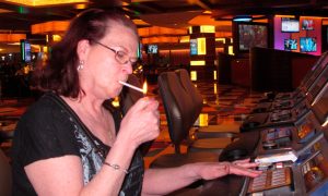 Woman smokes a cigarette at Tropicana Casino in Atlantic City