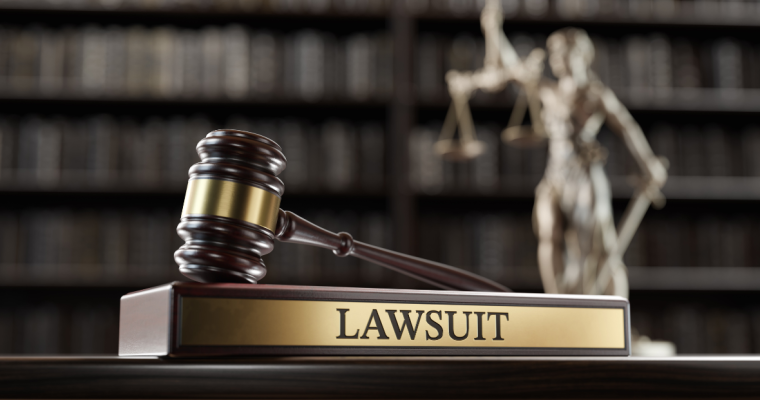 a gavel sitting atop of a label that reads lawsuit