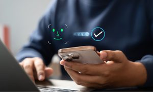 Smartphone showing a facial scan icon and verification checkmark