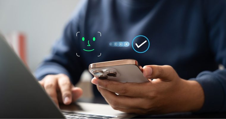 Smartphone showing a facial scan icon and verification checkmark
