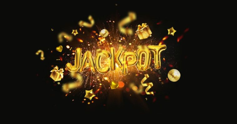 Gold balloon letters spelling JACKPOT surrounded by confetti and fireworks