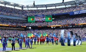 Players and flag bearers on the field before a FIFA World Cup match at MetLife Stadium
